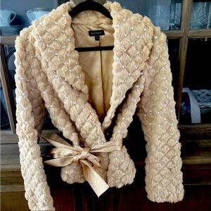 Brand new Bebe faux fur coat with pearl beads and silk belt